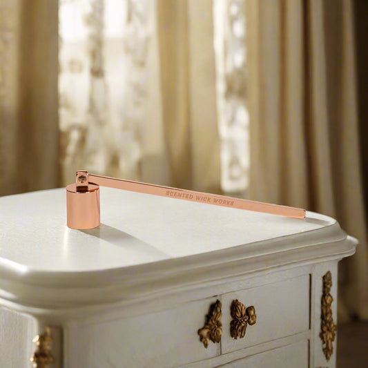 candle wick snuffer in rose gold